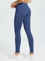 Navy blue water-resistant 3/4 thermal ski leggings with side pocket and reflective dots. #color_Navy Blue