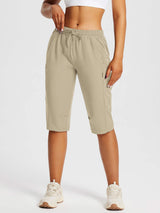 Tan Laureate UPF50+ DWR pocketed capris with drawstring for everyday outdoor comfort. #color_Doeskin