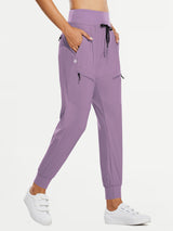Lavender women's tall high-waisted quick-dry hiking joggers with elastic cuffs and zippered pockets.