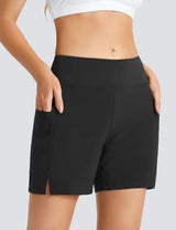 Laureate Women's black 5" high-waisted swim shorts with pockets and side slits. #color_Black