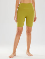 Women's 8" light compression yoga shorts in moss green, featuring a high rise and side pockets.