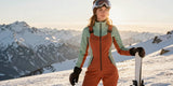 women's ski bibs in a vibrant terracotta