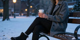 Woman in fleece lined winter leggings relaxing outdoors with coffee