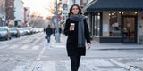 Woman wearing fleece lined leggings walking to cafe on cold winter morning