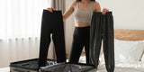 Woman packing suitcase deciding between leggings or joggers for travel comfort