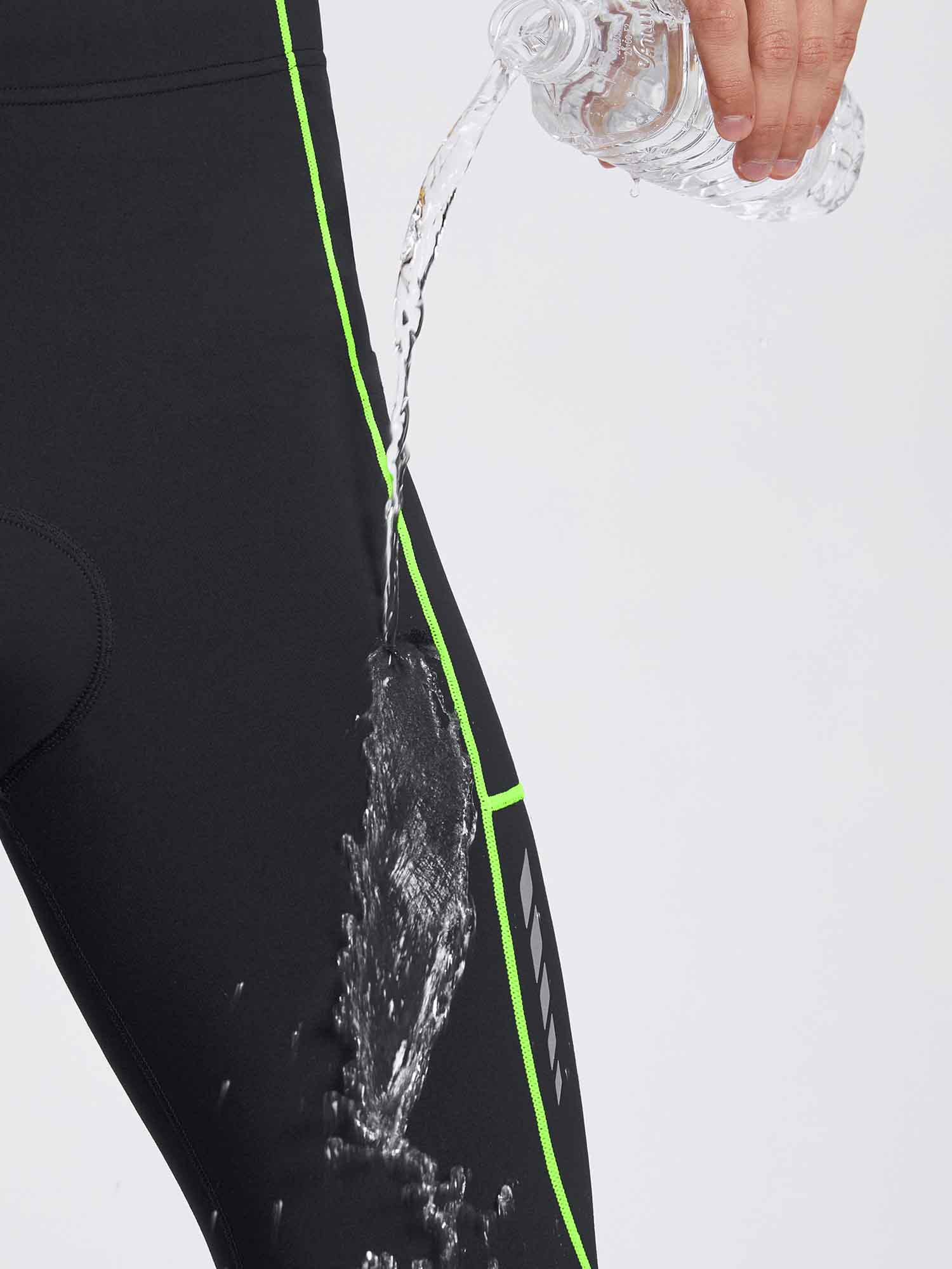 Black men's thermal cycling tights with neon green piping, showing water-repellent feature. #color_Flourescent Green