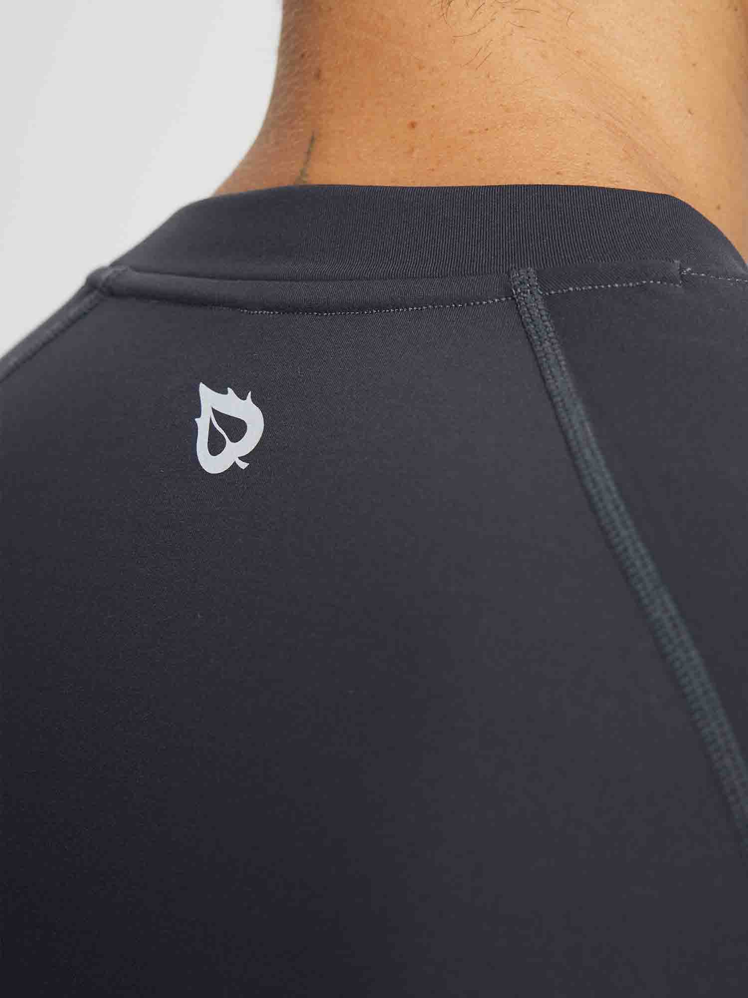 Dark gray men's half-mock knit fleece running top with a subtle white logo on the upper back. #color_Dark Gray