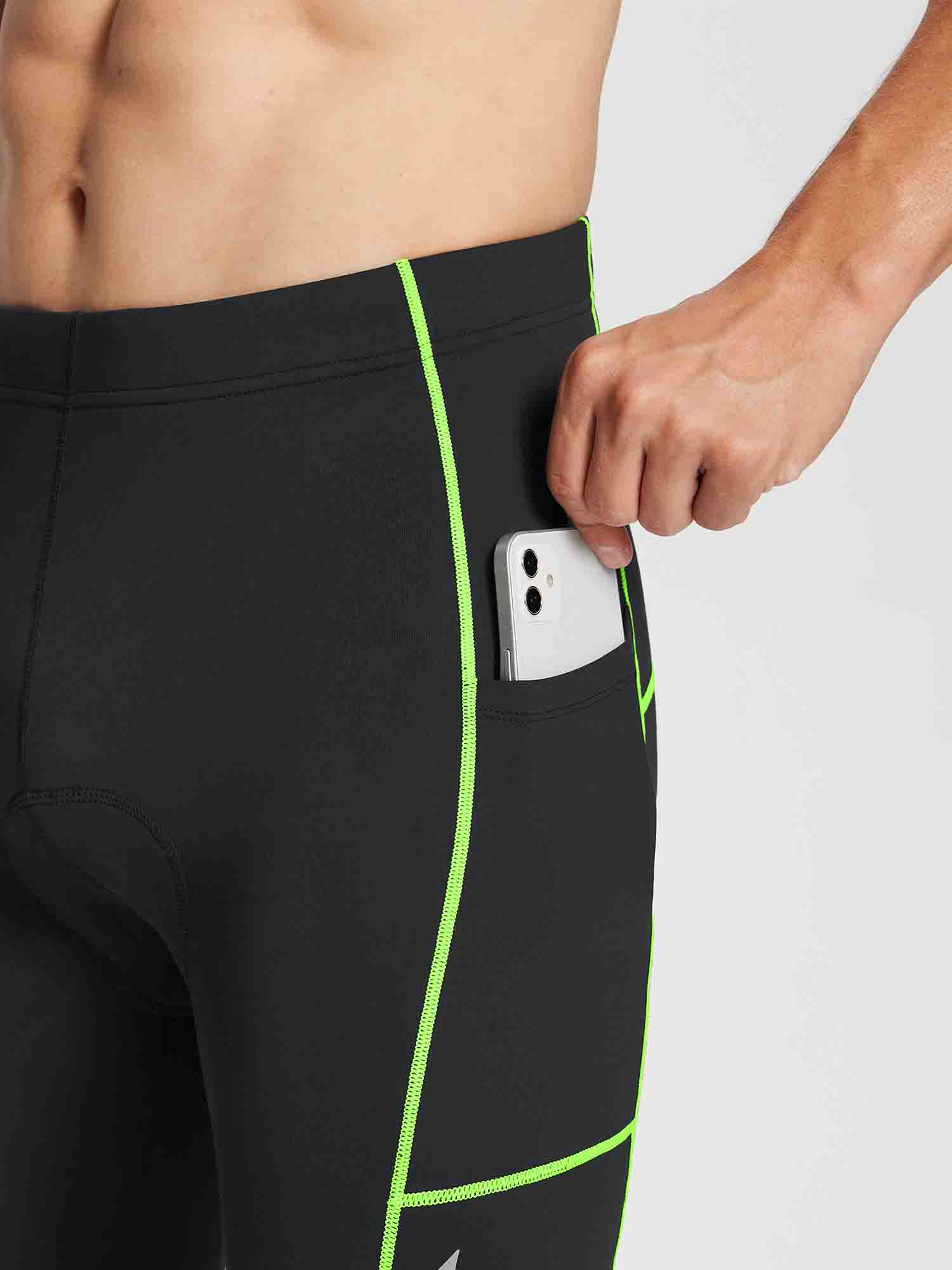 Black men's thermal cycling tights with neon green stitching and a side pocket holding a smartphone. #color_Flourescent Green