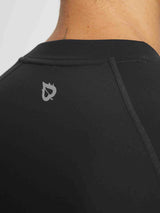 Men's black BALEAF running top with reflective logo and ribbed half-mock neck #color_Black