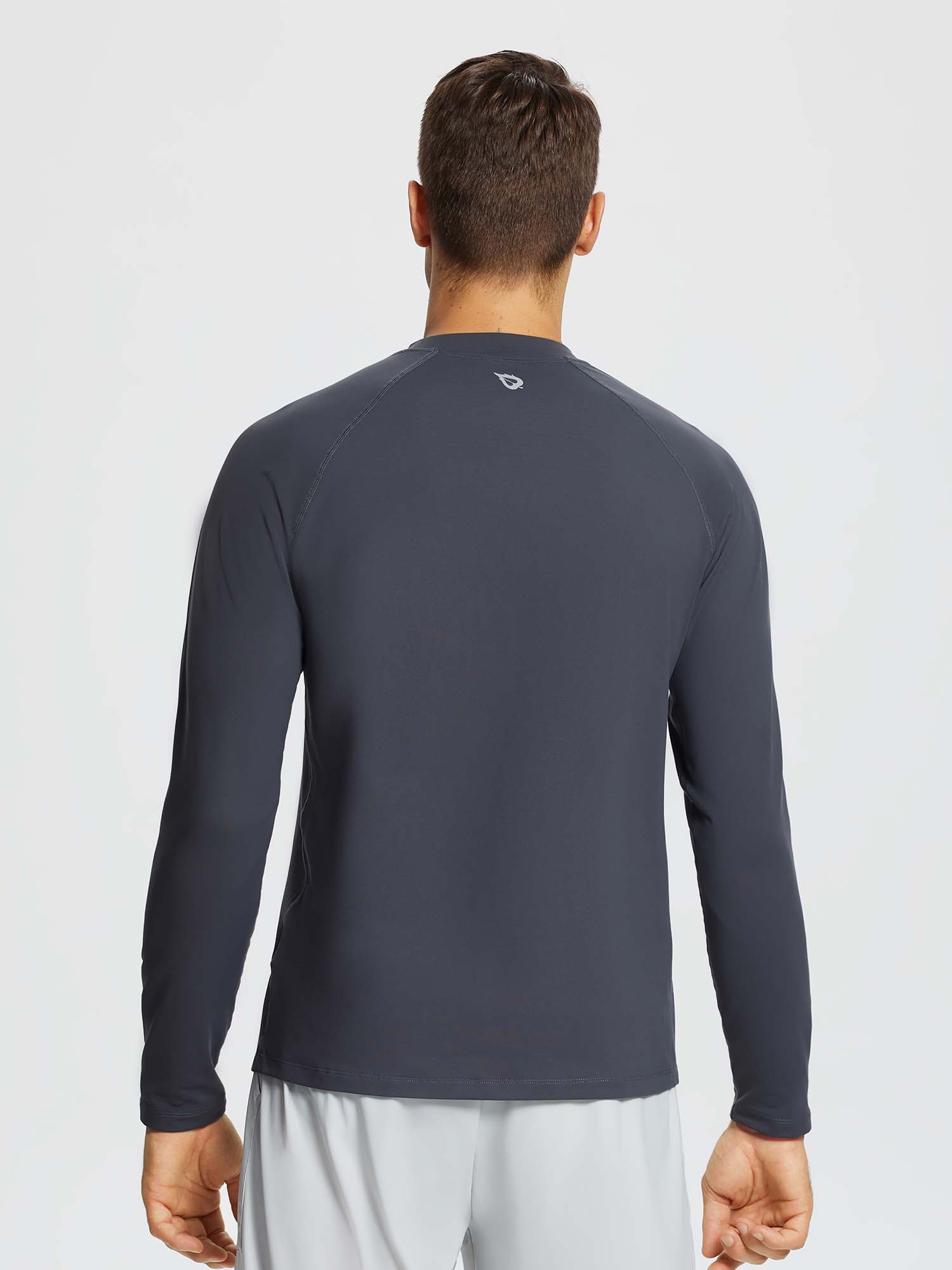 Men's dark grey half-mock knit fleece running top with raglan sleeves and subtle logo on back #color_Dark Gray
