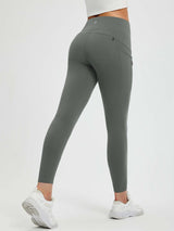 Women's 25" fleece-lined yoga leggings in dark gray with side pockets and zippered pocket #color_Dark Gray