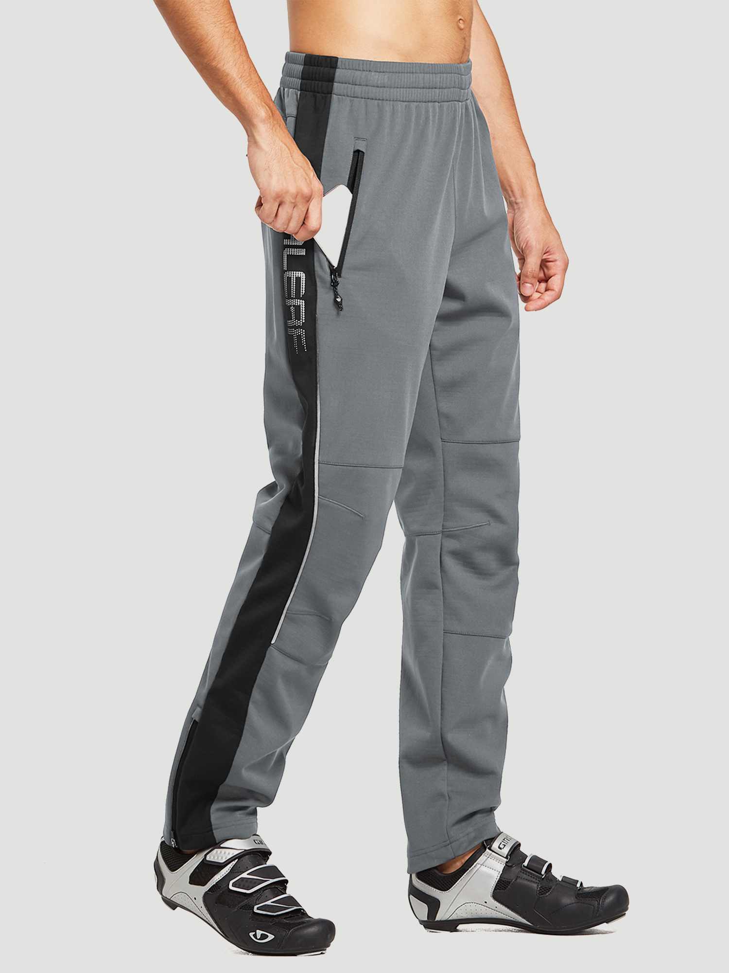 Men's grey knit fleece cycling pants with black side stripe and zippered pocket holding a smartphone. #color_Gray/Black
