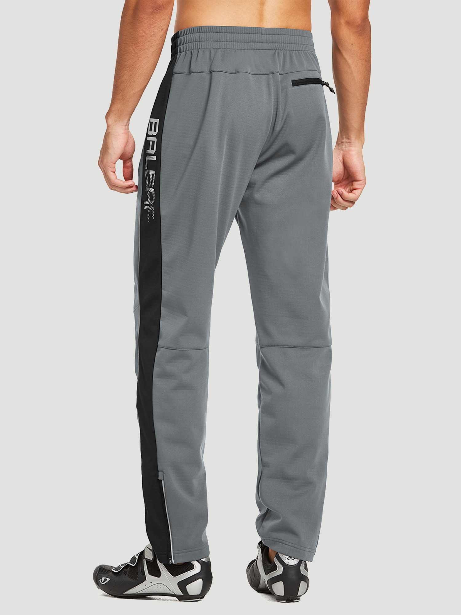 Men's gray knit fleece cycling pants with black side stripe and zippered ankles. #color_Gray/Black