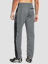 Men's gray knit fleece cycling pants with black side stripe and zippered ankles. #color_Gray/Black