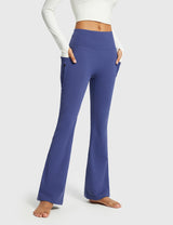 Navy blue thermal flare yoga pants with zipper pockets. High-waisted, bootcut activewear. #color_Navy Blue