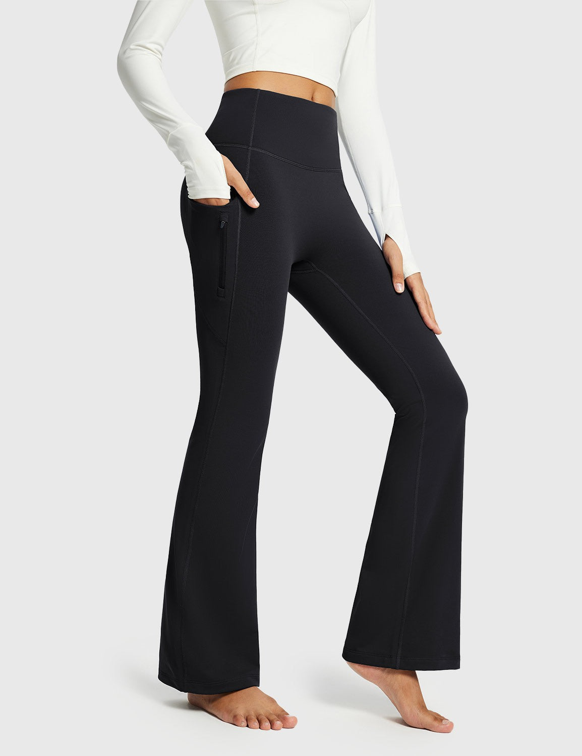 Black thermal warm flare yoga pants with pockets. High-waisted, flared design for activewear. #color_Black