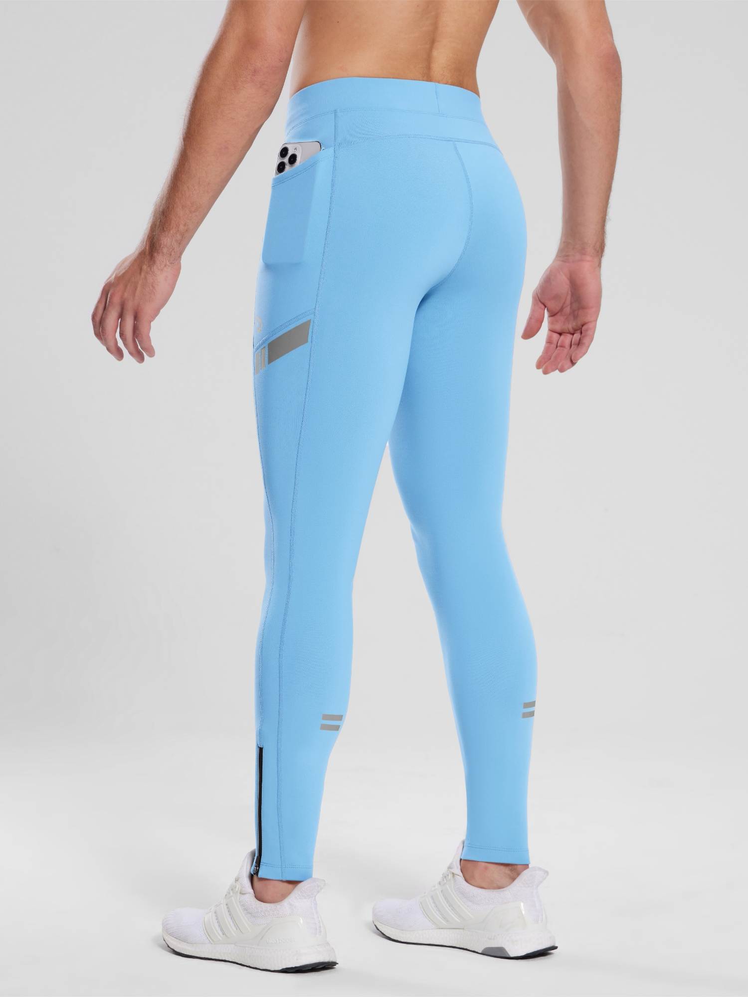 Men's light blue fleece-lined cycling tights with phone pocket and reflective accents #color_Blue