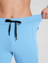 Light blue men's fleece-lined cycling tights with black drawstring and side pocket. #color_Blue
