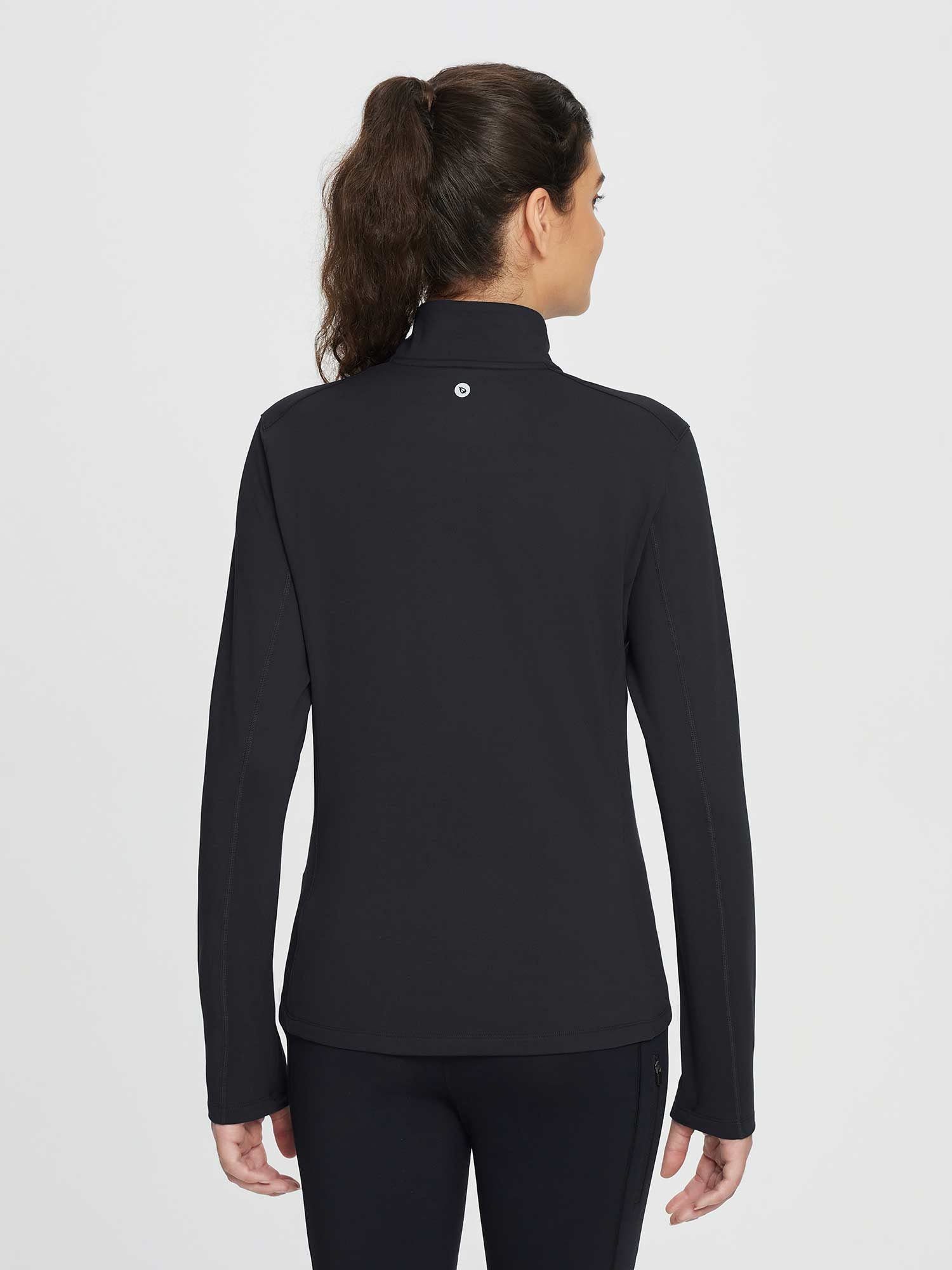 Women's black half-zip fleece pullover golf top with high neck and zippered pocket leggings. #color_Black
