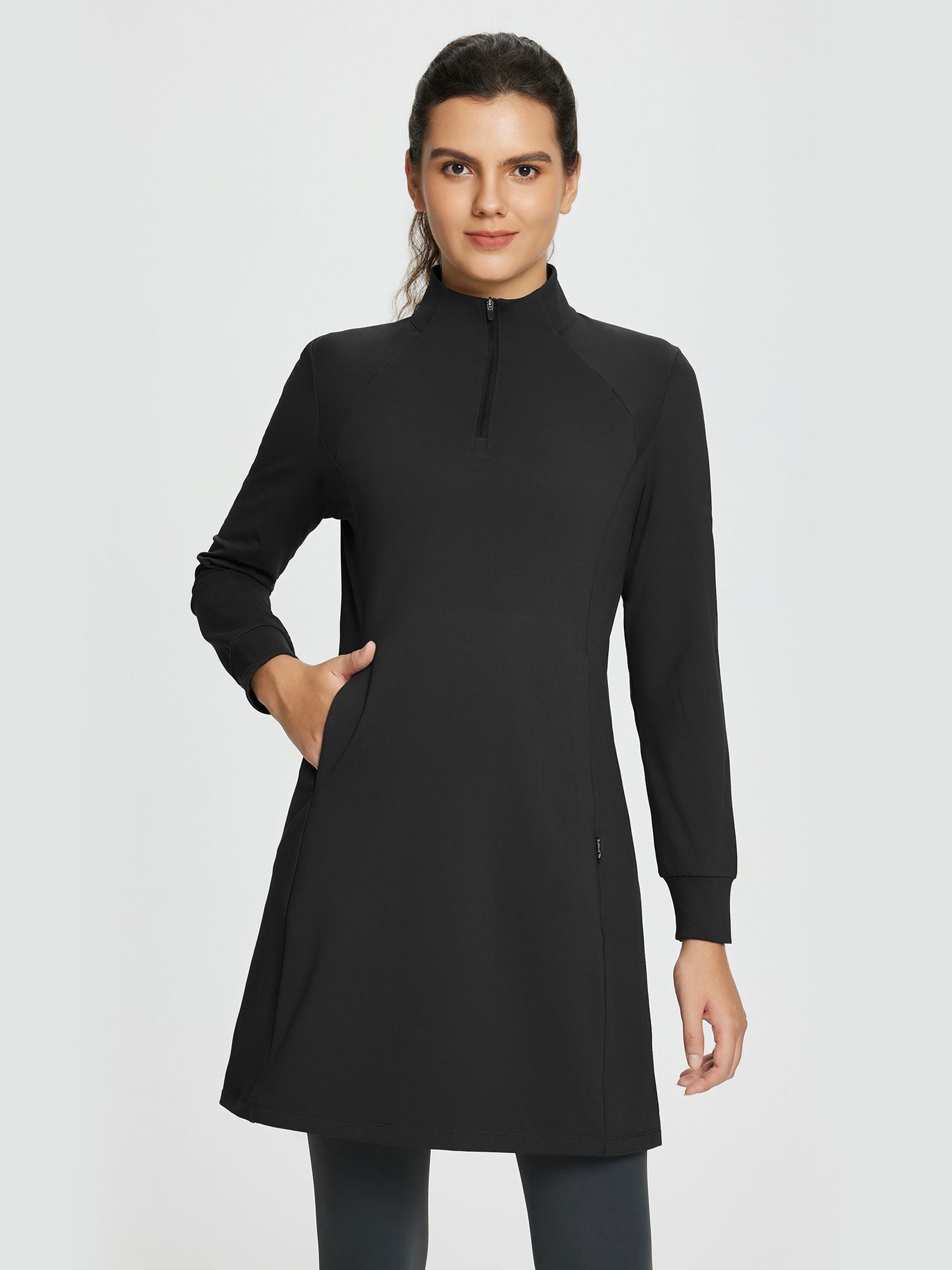 Black fleece-lined knit dress with mock neck and half-zip. Long sleeves, side pockets. Versatile outdoor wear. #color_Black