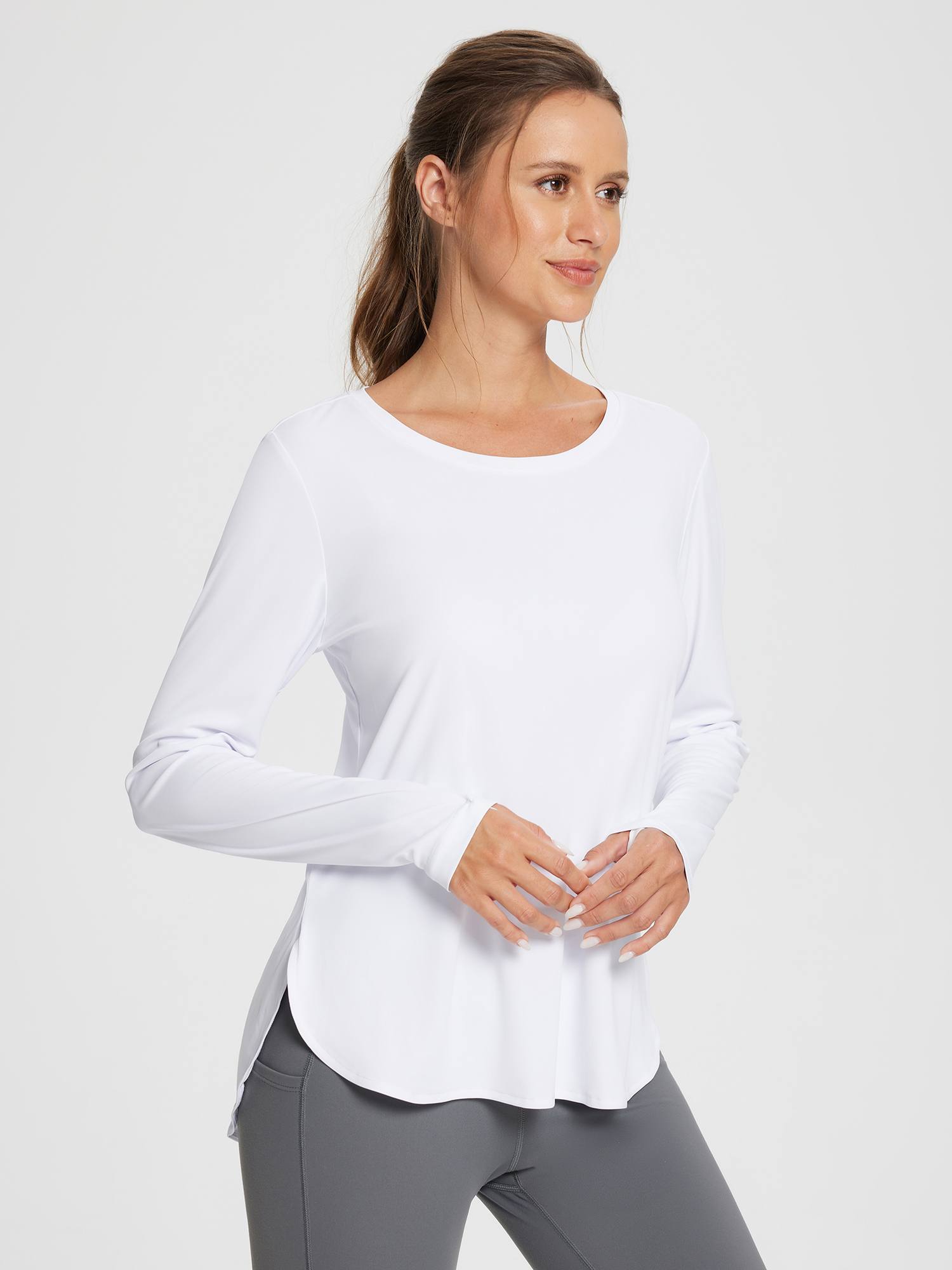 White women's outdoor long sleeve t-shirt with thumbholes and side slits #color_White