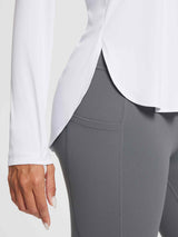 White outdoor long-sleeve t-shirt with side slits and grey leggings, UPF 50+.