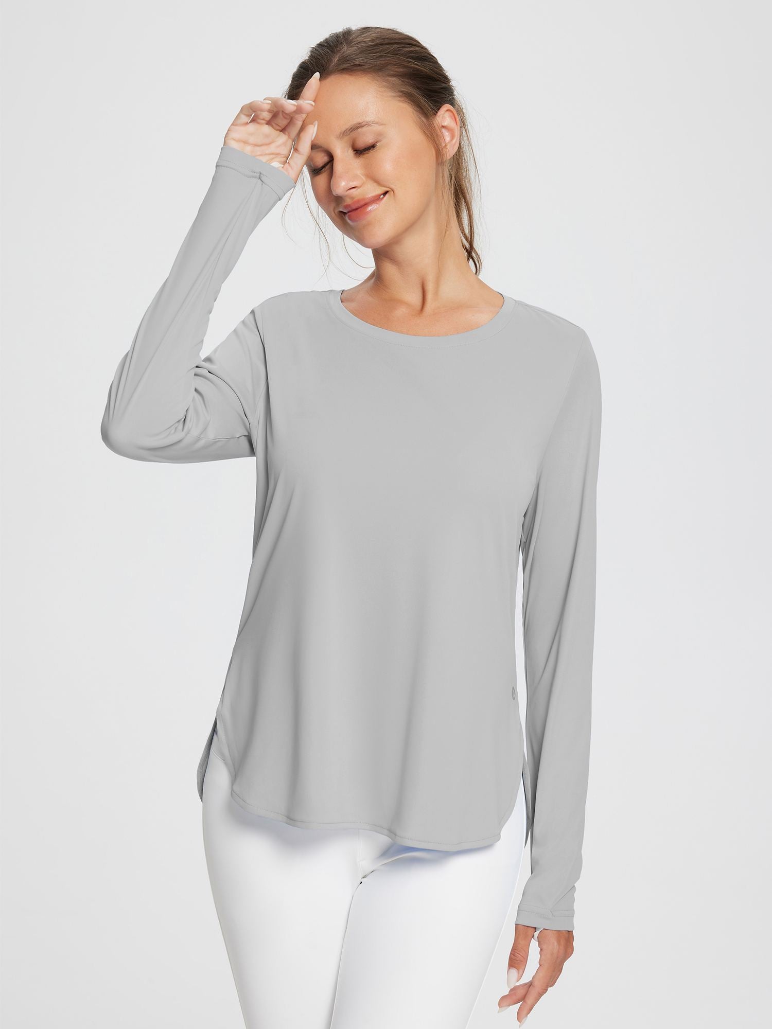 Grey women's outdoor long sleeve t-shirt with thumbholes and high-low hem. #color_Light Gray
