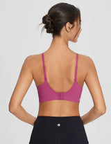 Pink Y-back sports bra with adjustable straps and hook closure, shown from back with black leggings. #color_Cactus Flower