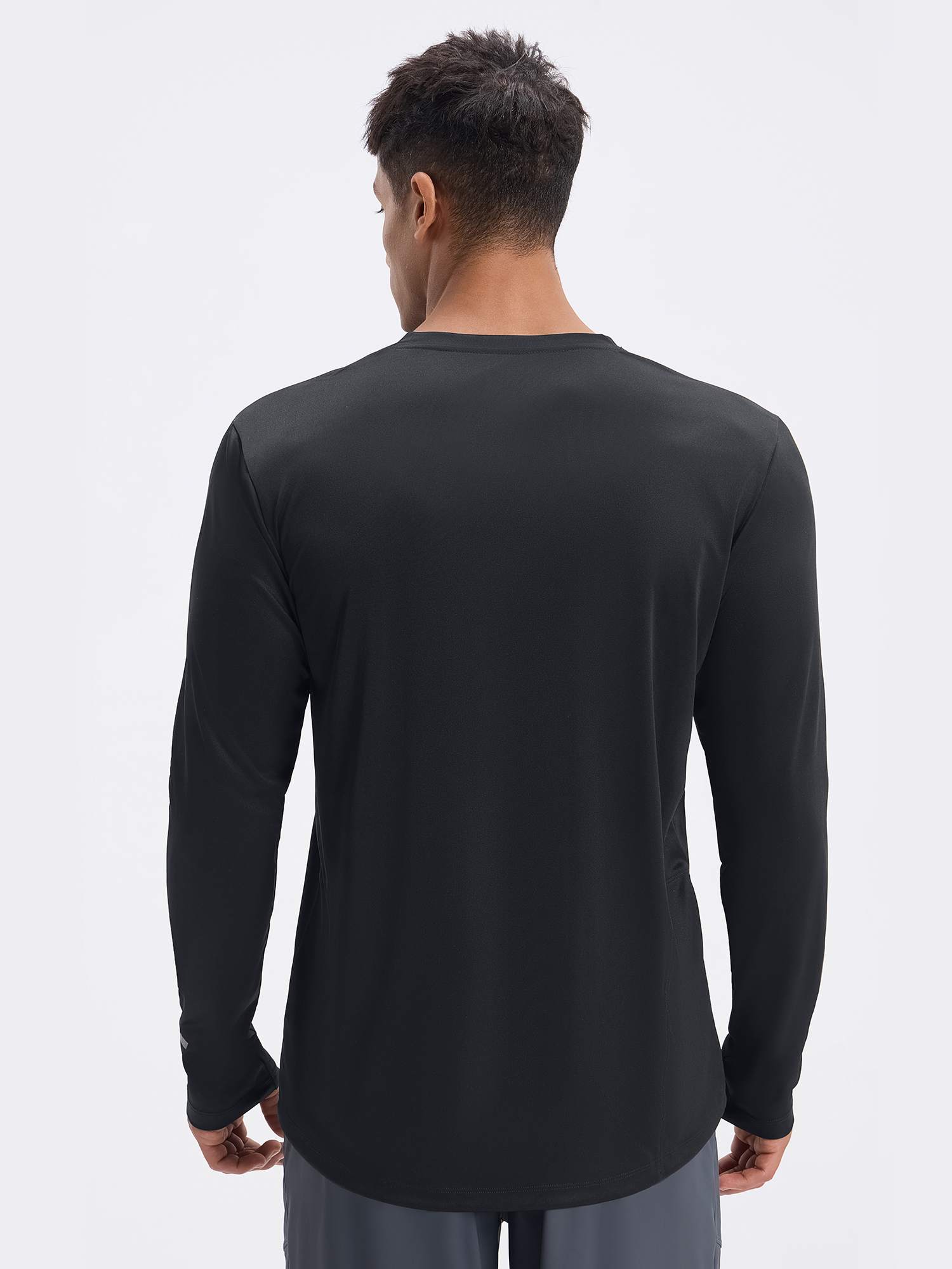 Men's black long sleeve cycling shirt with reflective details on the wrist. #color_Black