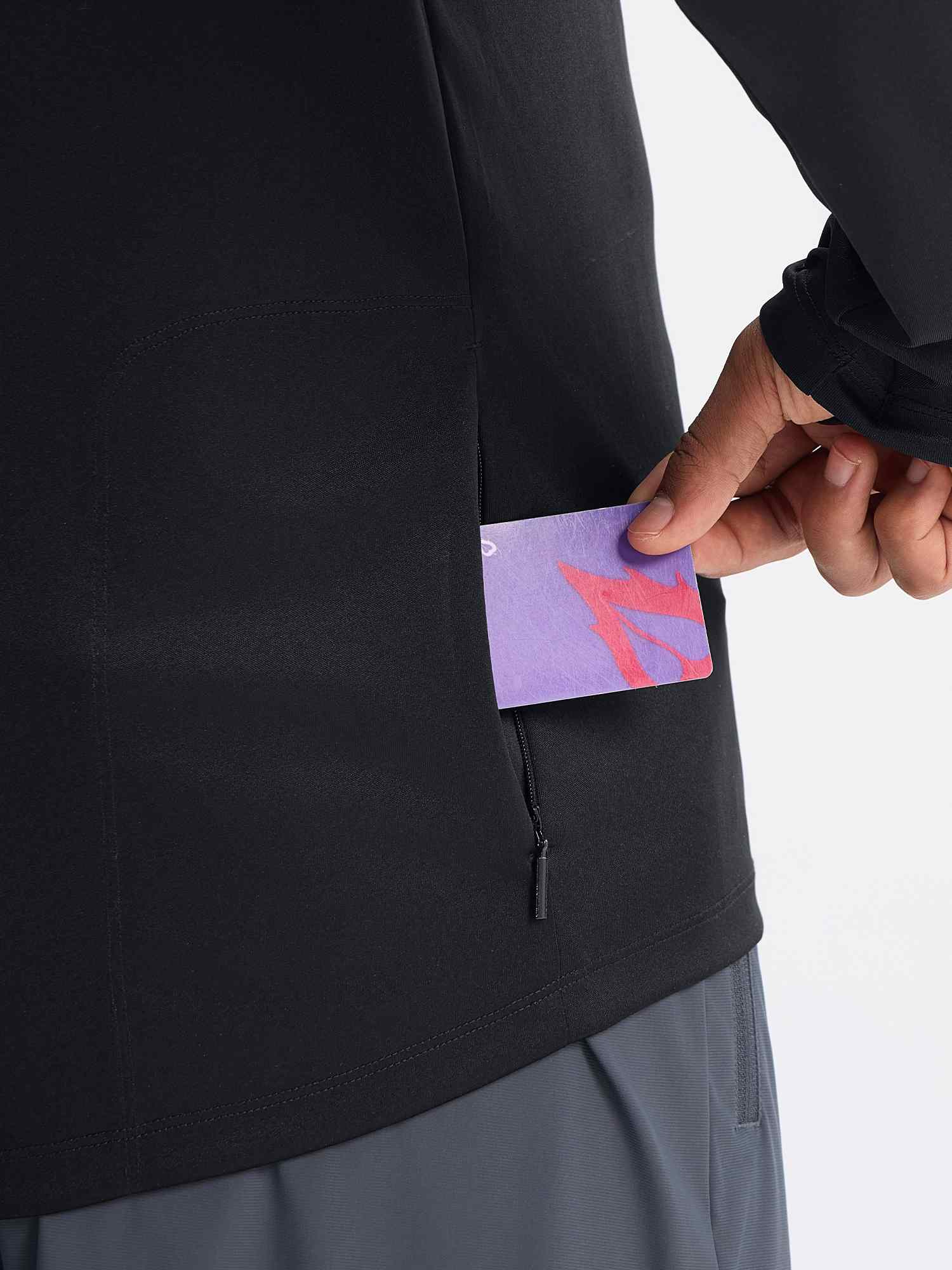 Man's black long sleeve cycling shirt with hidden zipper pocket holding card #color_Black