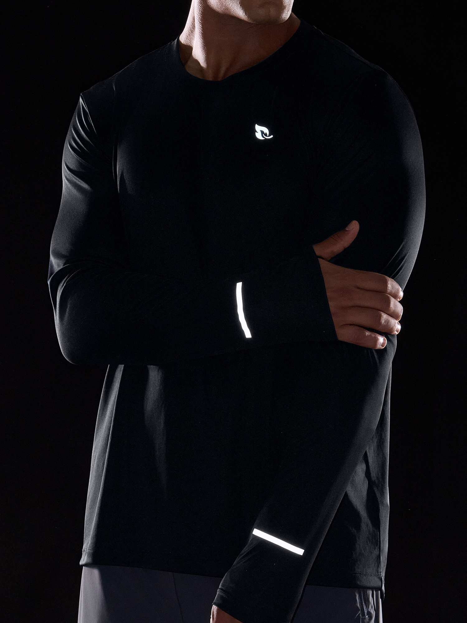 Men's black long sleeve cycling shirt with reflective details and UPF50+ sun protection #color_Black