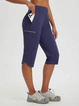 Navy blue women's 17" capris with zippered pockets, perfect for cycling and hiking. #color_Navy Blue