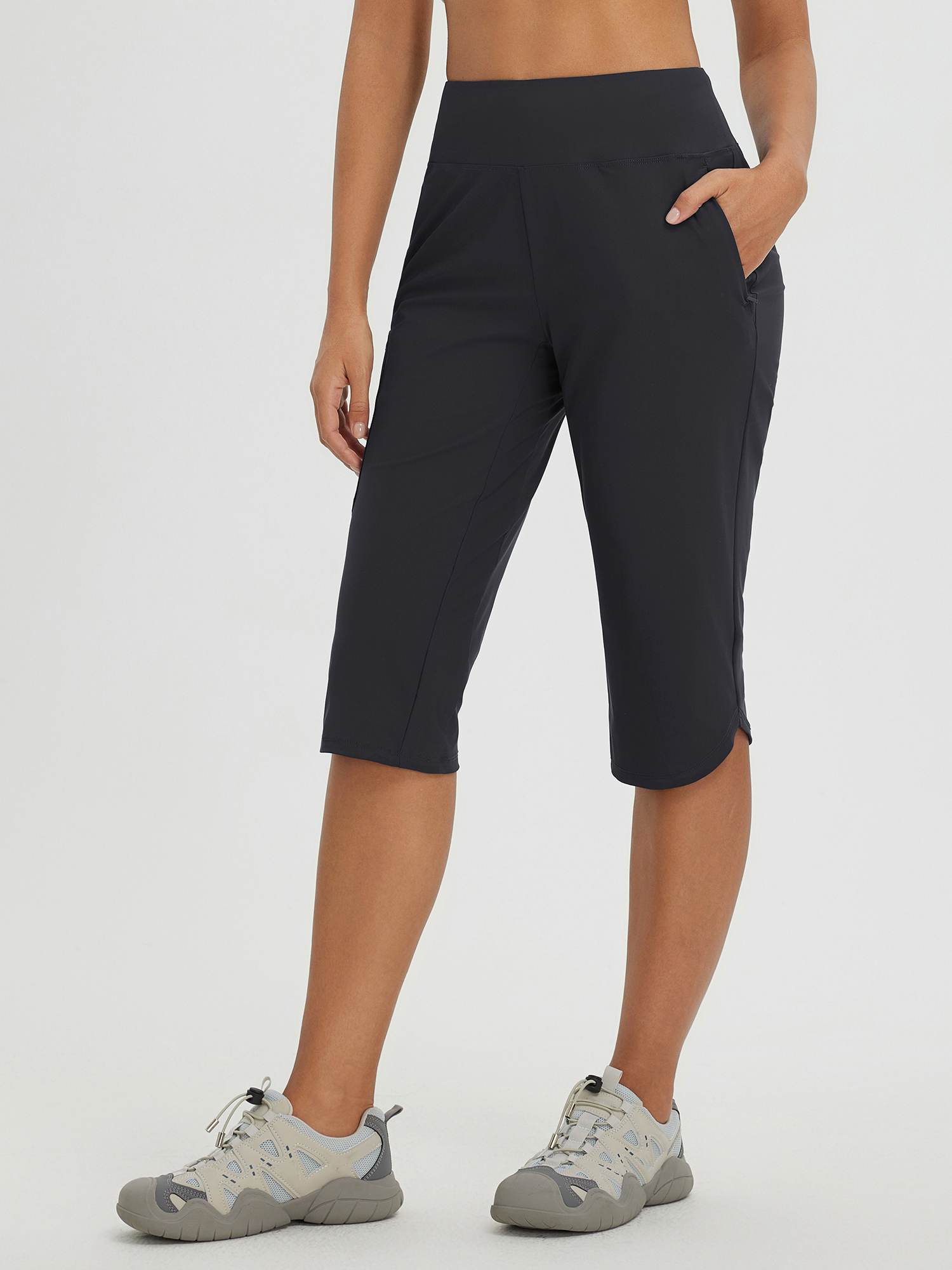 Women's dark gray 17" cycling hiking capris with elastic waistband and pockets. Lightweight, quick-dry fabric. #color_Black