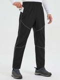 Black quick-dry cycling pants with contrast stitching, zippered pockets, and ankle zips. #color_Frost Gray