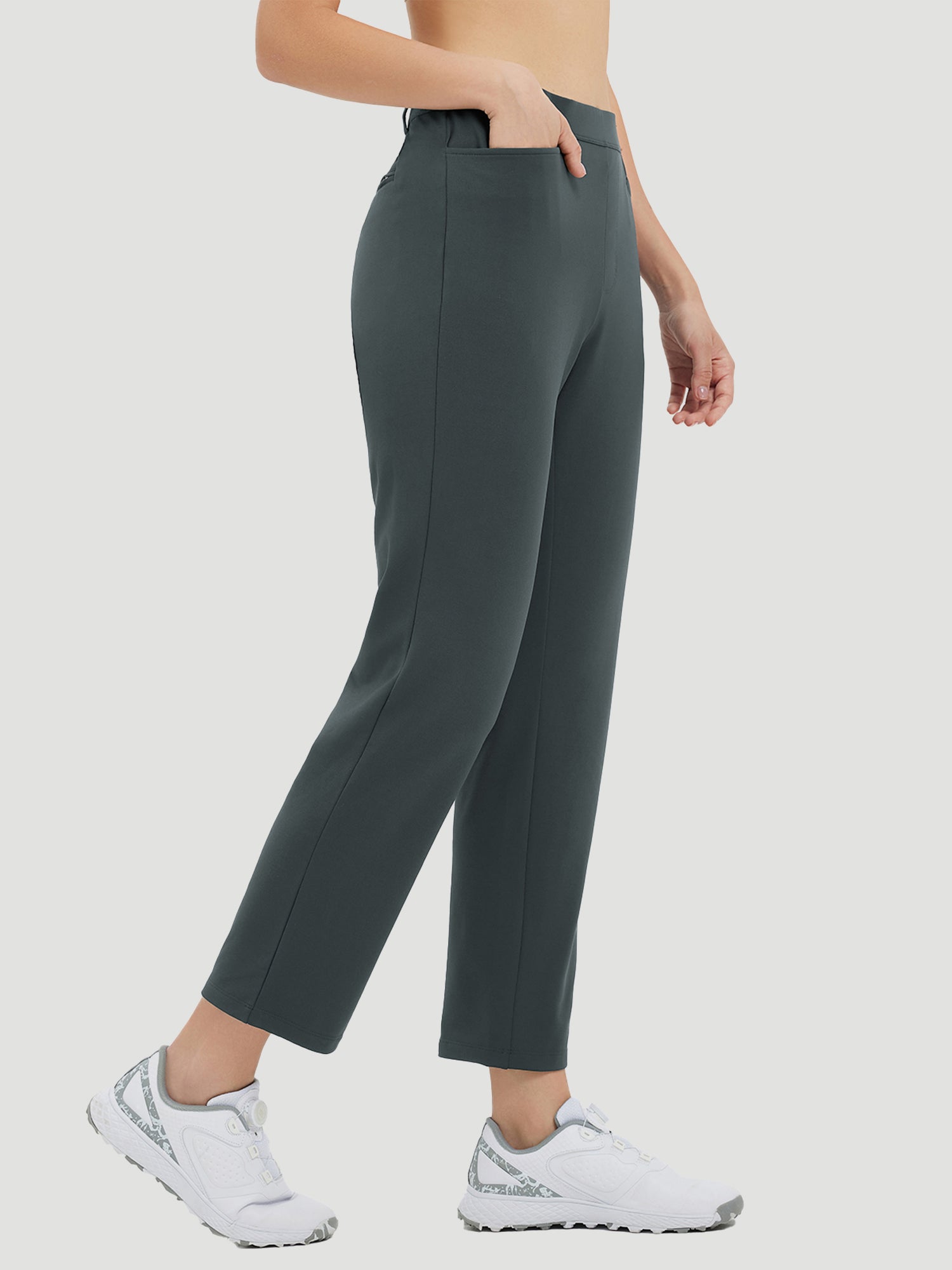 Dark grey golf fleece straight-leg pants with pockets and white athletic shoes. #Color_Dark Gray