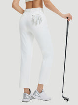 Woman in white golf fleece straight-leg pants with golf club and glove. #Color_Star White