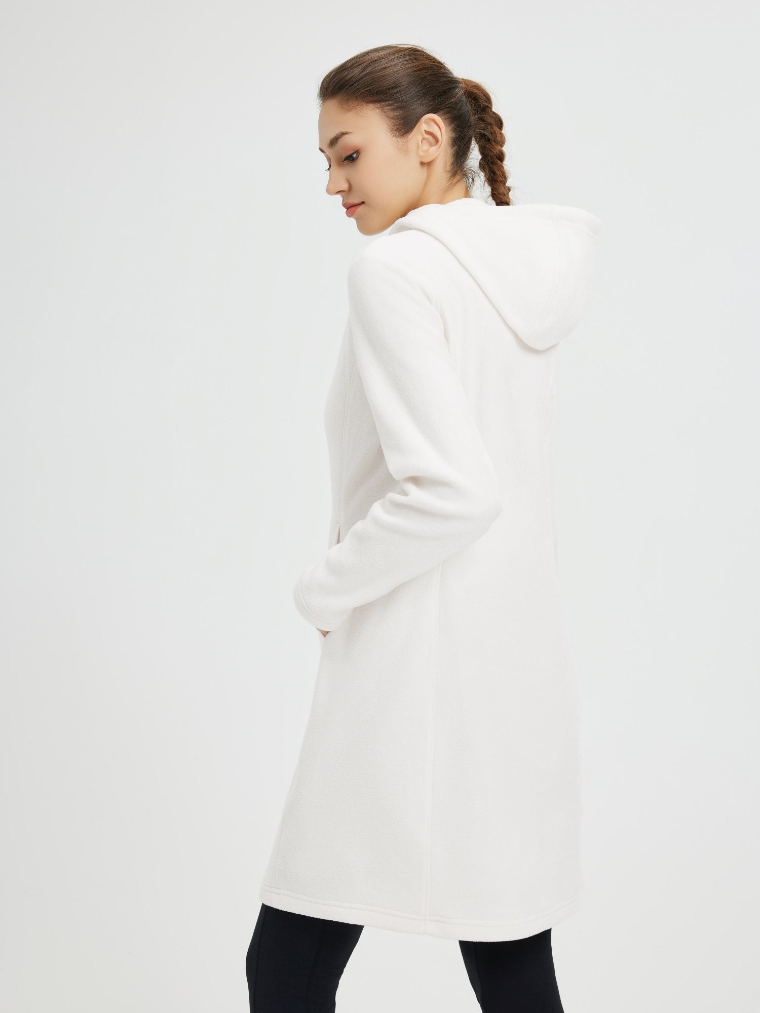 White hooded fleece dress with kangaroo pocket, perfect for outdoor activities. #color_White