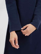 Navy blue hooded fleece dress detail: hands adjusting cuff. Women's outdoor knit style. #color_Navy Blue