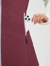 Burgundy women's woven hiking vest, hand places smartphone in side pocket. #color_Wine Red