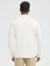 Men's white fleece running long-sleeve t-shirt with half-zip and tan pants, rear view. #color_Star White