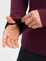 Men's running fleece long-sleeve t-shirt in wine red, showing thumbholes and chest pocket detail. #color_Wine Red