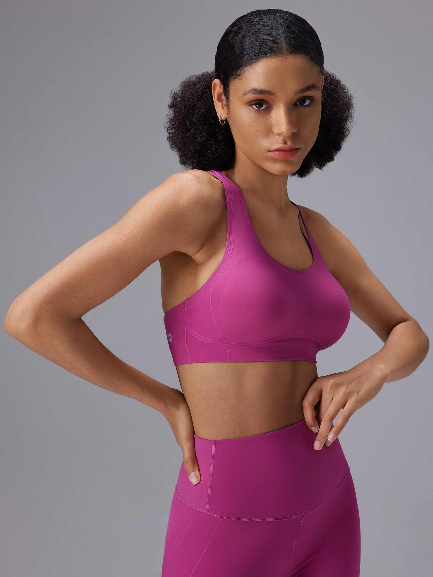 Pink low impact sports bra and high-waisted leggings - activewear essentials. #color_Cactus Flower
