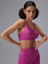 Pink low impact sports bra and high-waisted leggings - activewear essentials. #color_Cactus Flower