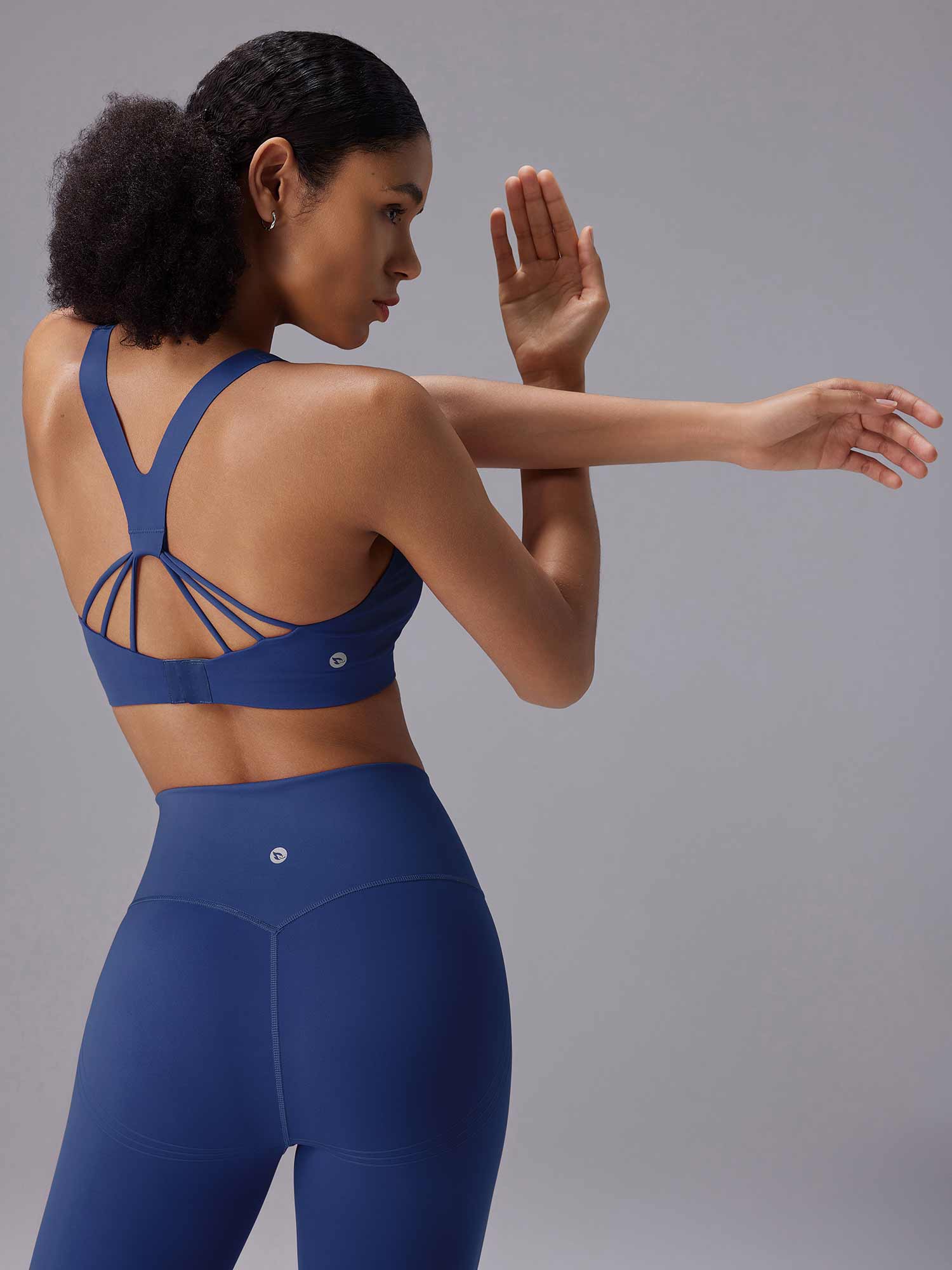 Blue yoga set with strappy back sports bra and high-rise shorts for yoga and lounging. #color_Estate Blue