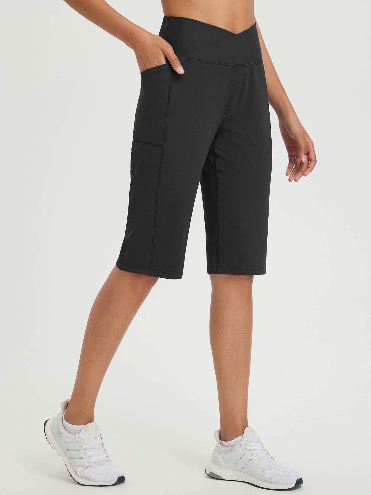 Secret Breeze 14" high-rise Bermuda shorts in black with crossover waist and pockets. #color_Anthracite