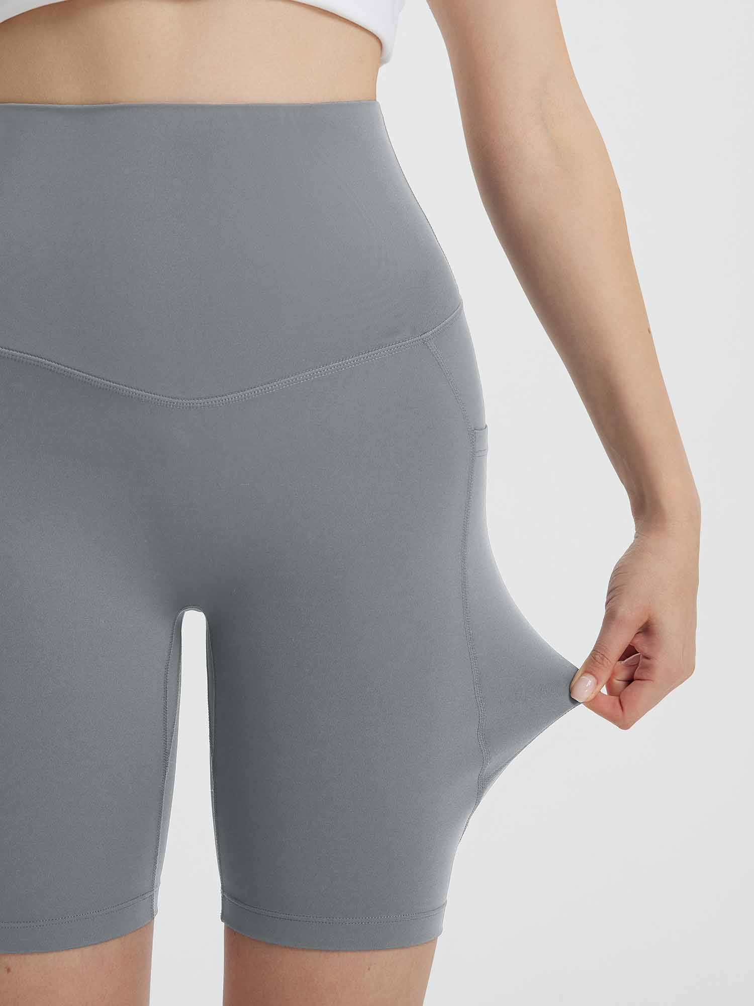 Close-up of grey women's 8" super high-waisted biker shorts showing stretchy fabric and side pocket. #color_Dark Gray
