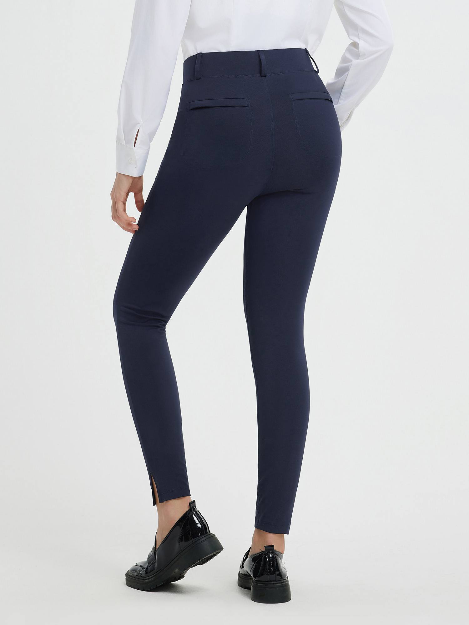 Women's navy yoga business pants with a high waist, split hem, and functional pockets. #color_Navy Blue