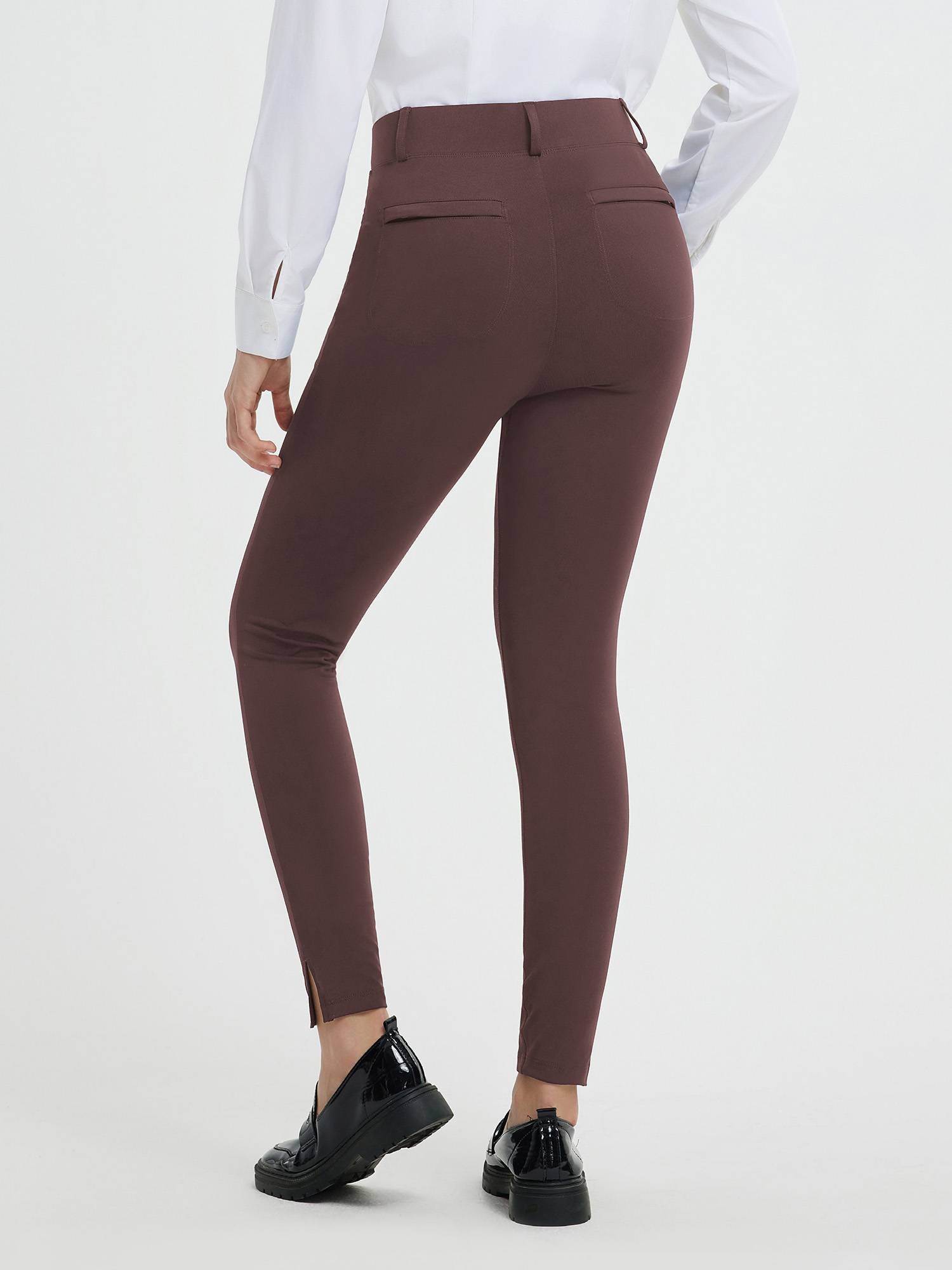 Women's brown high-waisted yoga business pants with split hem and functional pockets. #color_Dark Brown