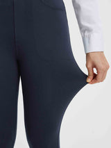 Close-up of navy blue women's yoga business pants being stretched to show flexibility. #color_Navy Blue