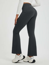 Women's charcoal floral fleece yoga pants with flared legs and pockets. #color_Black